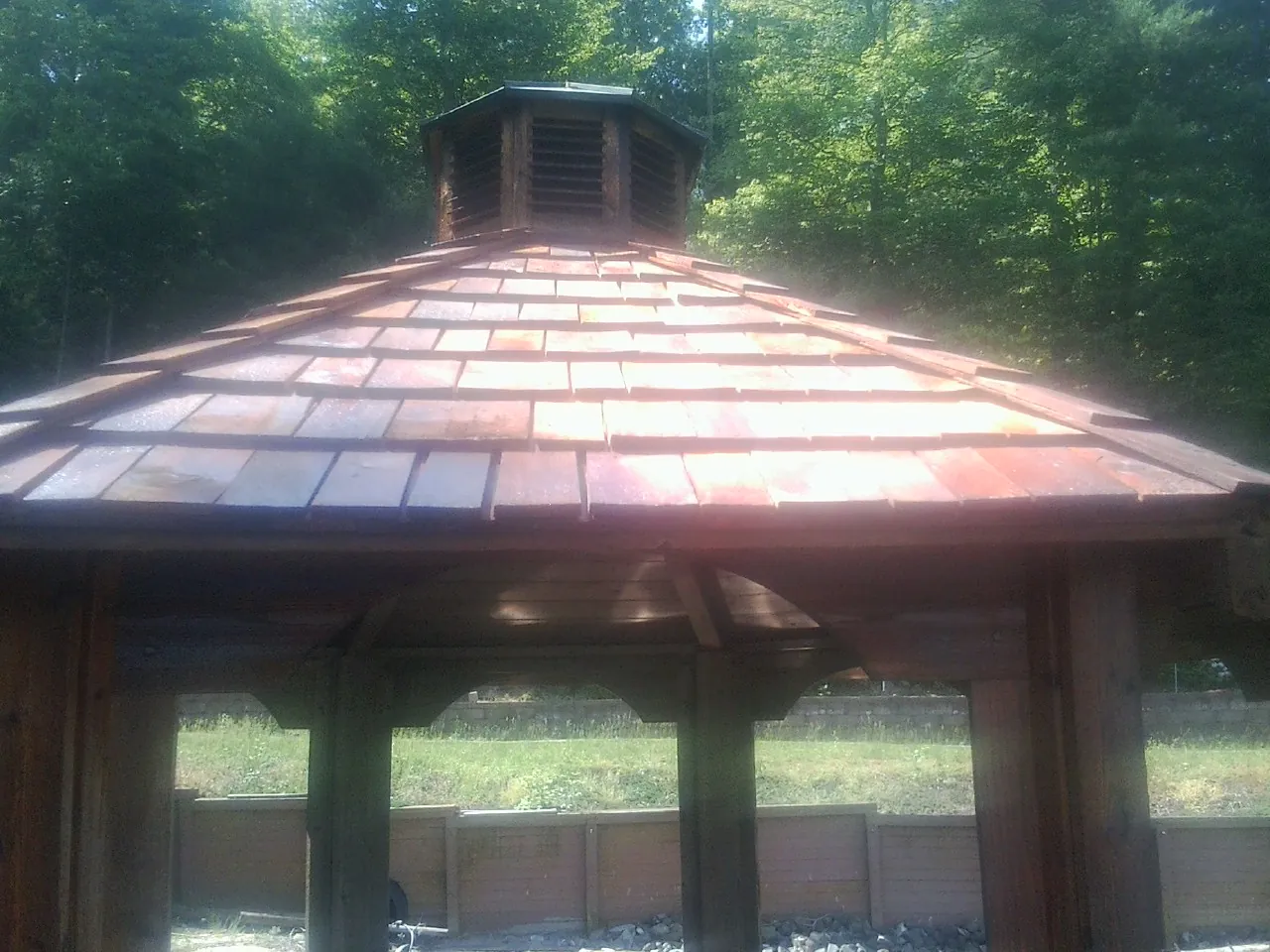 New cedar shake roof and cupola on a lakeside gazebo in Philipsburg